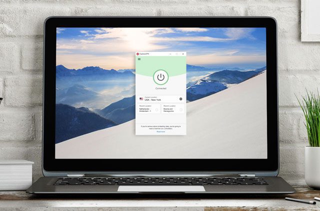 A laptop with the ExpressVPN app for Windows open on the screen.