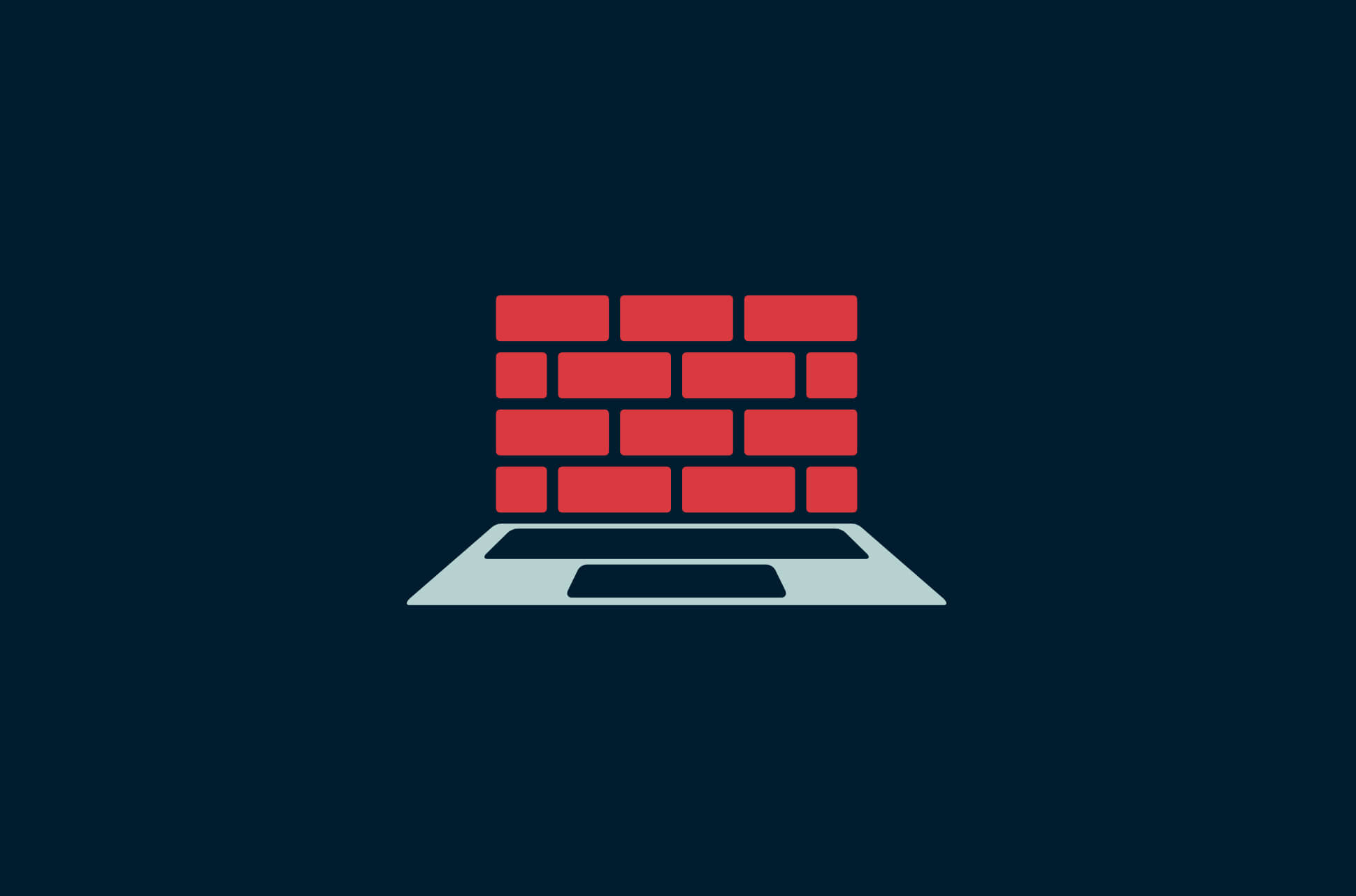 Laptop with a brick wall.